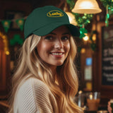 Woman wearing a green cap with 'Lucky' logo in a bar setting